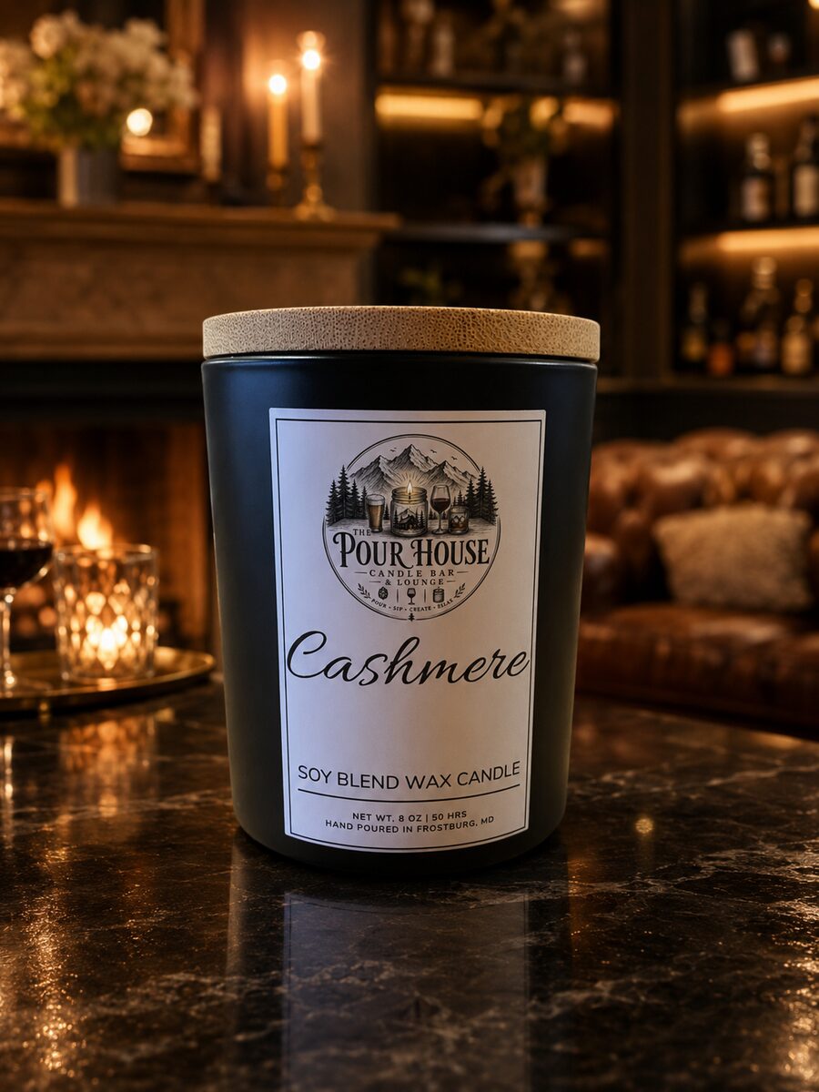 The Pour House Cashmere soy candle on the bar