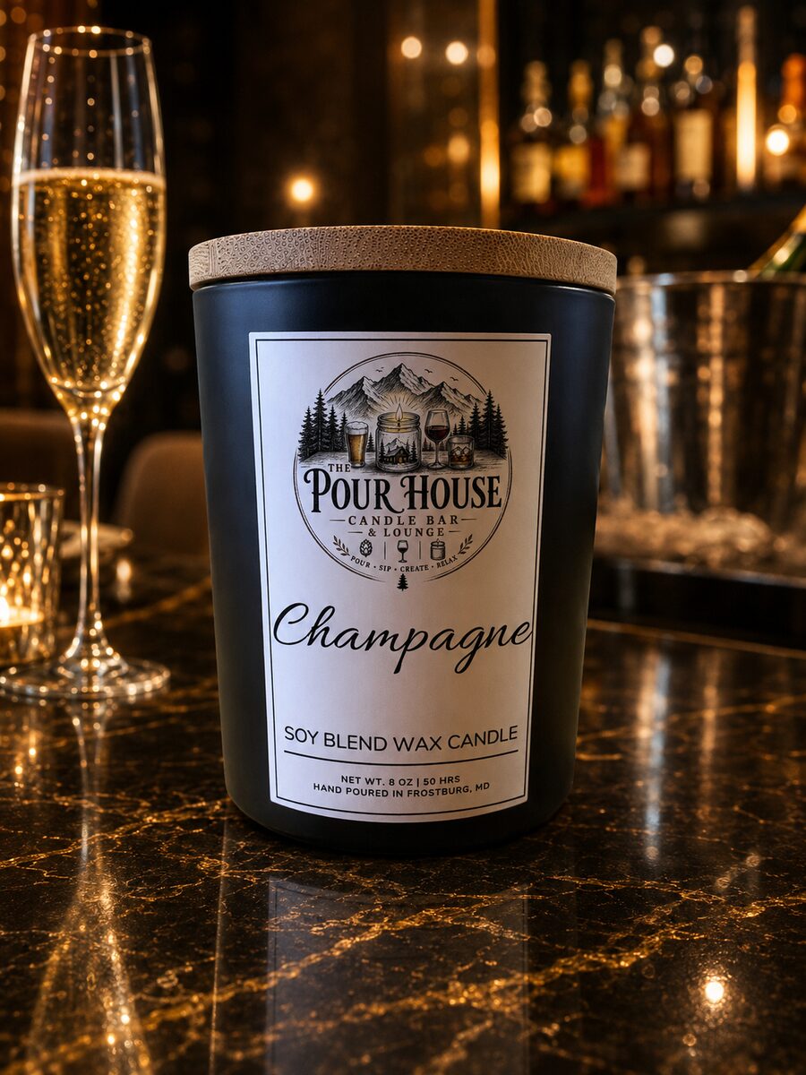 The Pour House Champagne soy candle on the bar