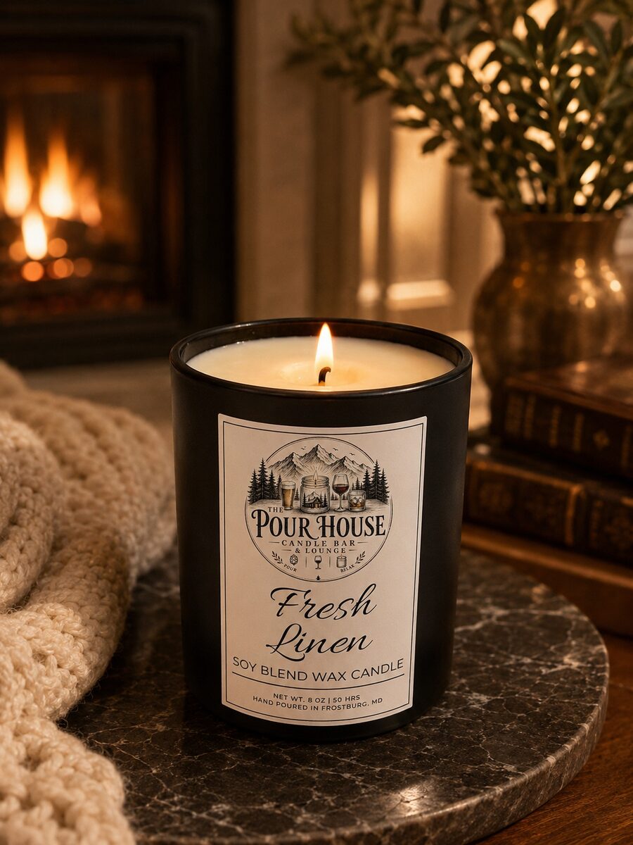 The Pour House Fresh Linen soy candle on the bar